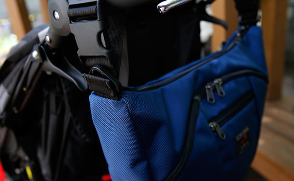 Parental Unit hung to a stroller using the Stroller/Wheelchair Strap.